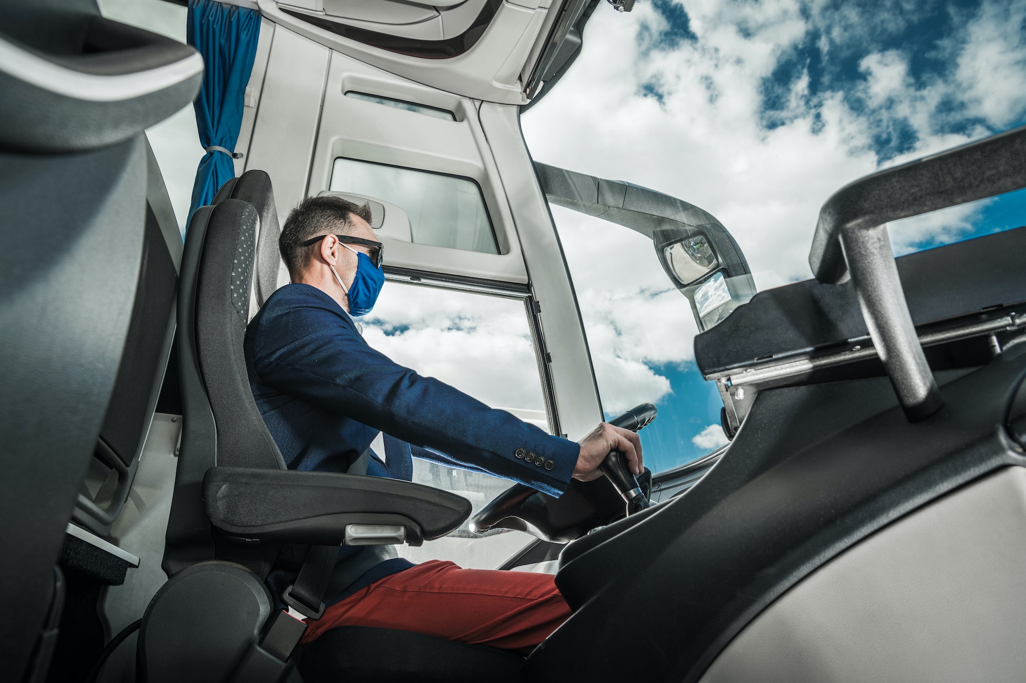 Shuttle Coach Bus Driver Inside the Modern Vehicle